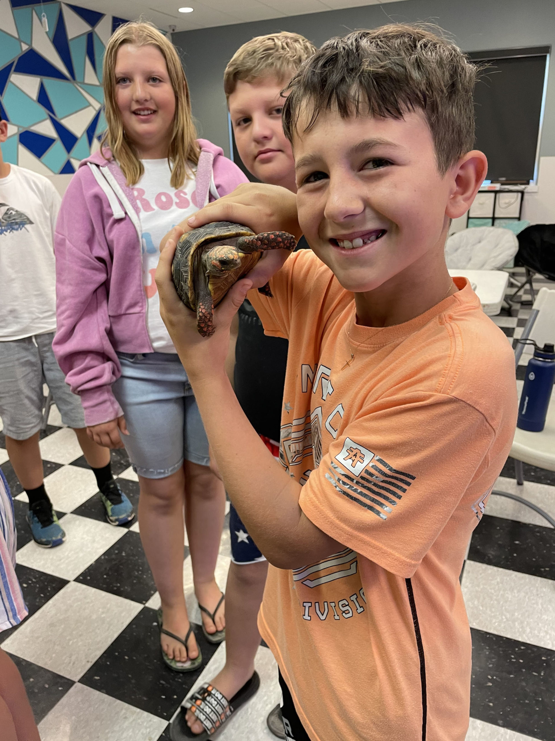 Children holding turtle during after school activities in Buhl, ID.
