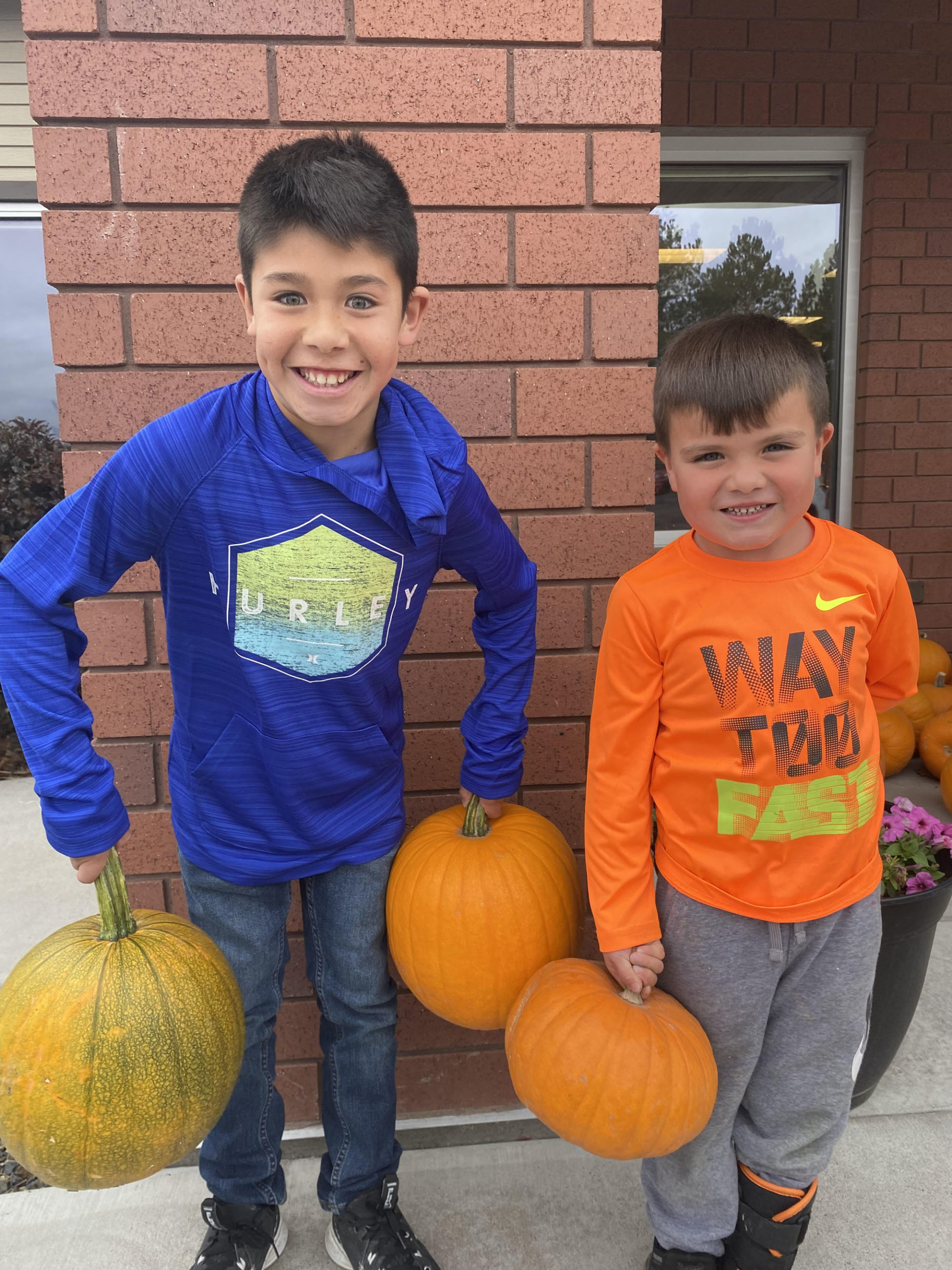 Boys holding pumpkins in after school activities in Buhl, ID.
